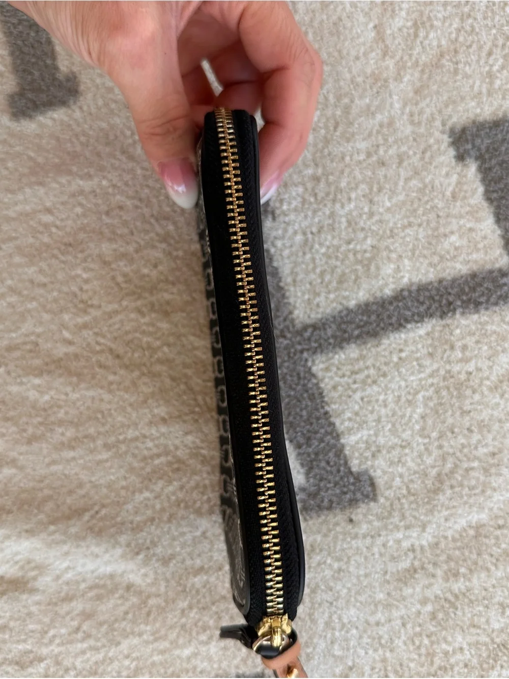 Tory Burch Black and Tan Patterned Logo Wristlet with Stripe Detail